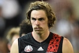 Essendon players trudge off after Anzac Day loss