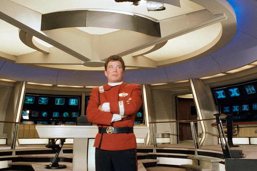 This 1988 file photo shows a young William Shatner in his Star Trek Captain Kirk costume aboard the Starship Enterprise