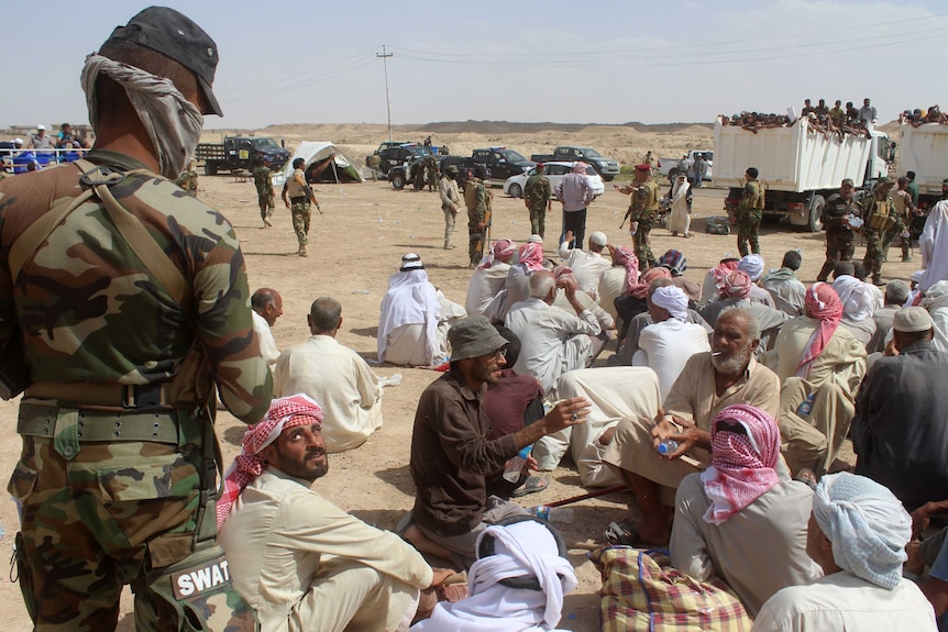 Displaced Iraqis who were evacuated from their villages by Iraqi government forces.