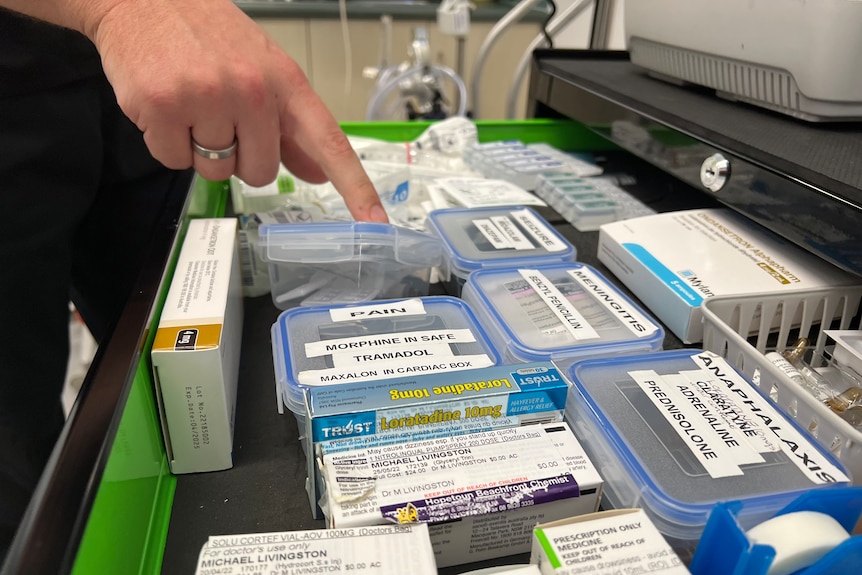 A draw filled with containers with labelled medicine inside