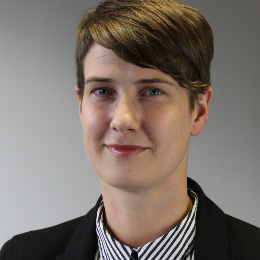 A profile image of a woman with short brown hair.