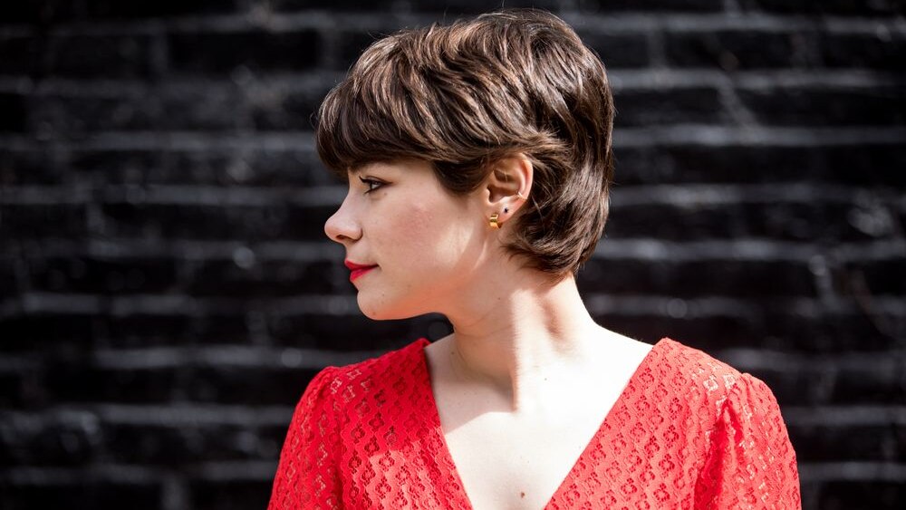 Laura Anglade in a red dress