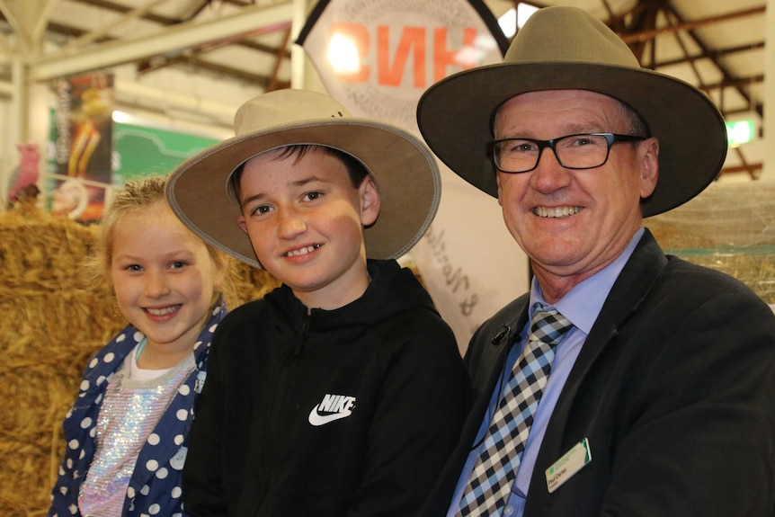 Paul Carter sitting alongside his 11-year-old son Thomas and his 8-year-old friend Lily Fitzgerald at the Royal Show.