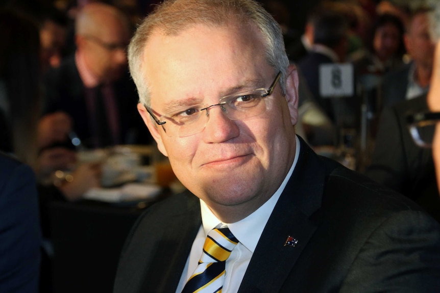 A head and shoulder shot of Scott Morrison sitting at a table at a business breakfast in Perth.