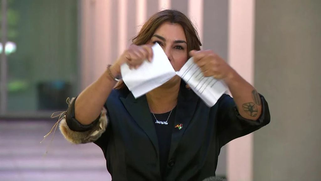 Lidia Thorpe rips up a piece of paper at a media conference.