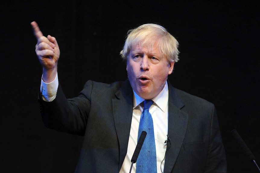 Boris Johnson speaks and wags his finger during a fringe event during the Conservative Party annual conference in Birmingham.