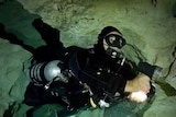 Joseph Bicanic is pictured underwater in a cave.