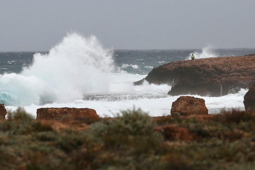 A big swell and waves crash into rocks at the Blowholes near Carnarvon.