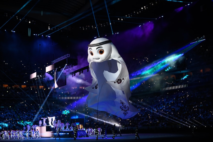 Qatar World Cup mascot La'eeb looms over the opening ceremony.