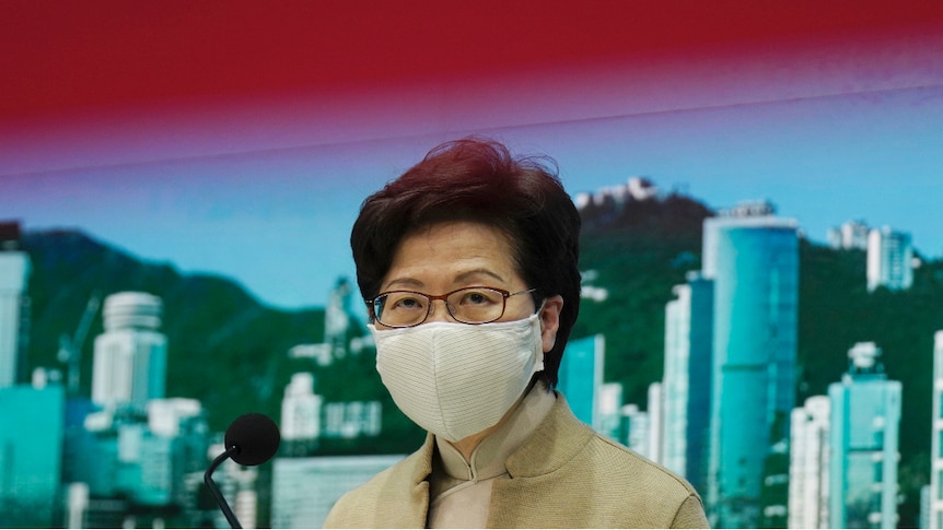 Hong Kong Chief Executive Carrie Lam wearing a face mask at a media conference.