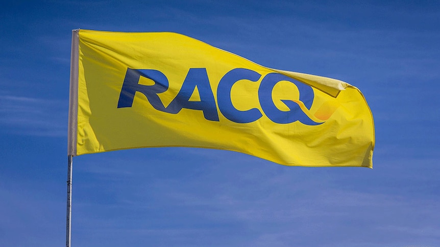 A yellow RACQ flag flies in a blue sky