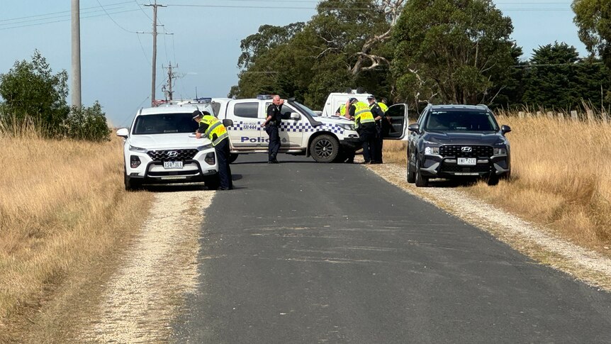 Police cars on rural road