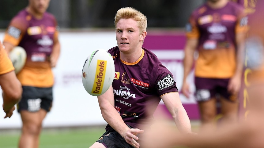 Brisbane Broncos player Tom Dearden passes the ball during training in Brisbane.