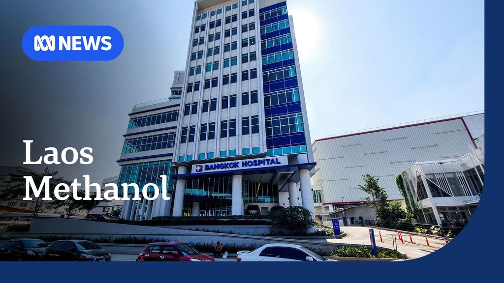 Laos Methanol: Bangkok Hospital building with blue and teal windows.