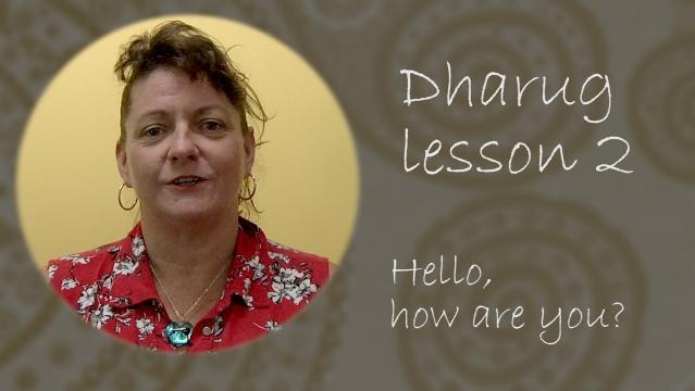 Woman beside text Dharus lesson 2 hello how are you?