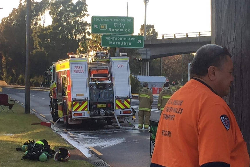 Emergency services say it will take hours to clean up the mess after a tanker overturned at Eastlakes.