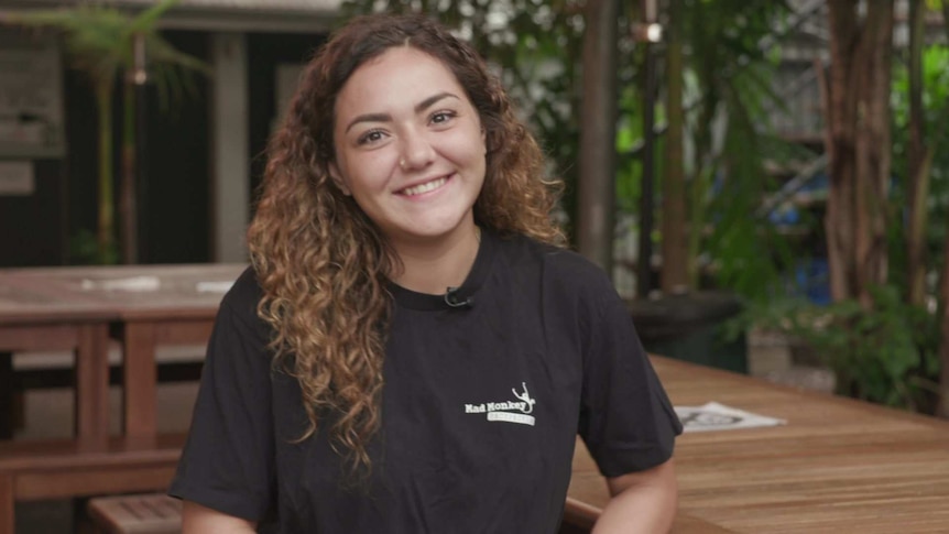 Hostel worker Daniella Yidi smiles into the camera.