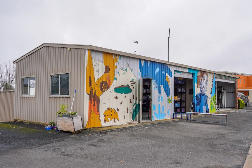 A garage painted with colourful animals.