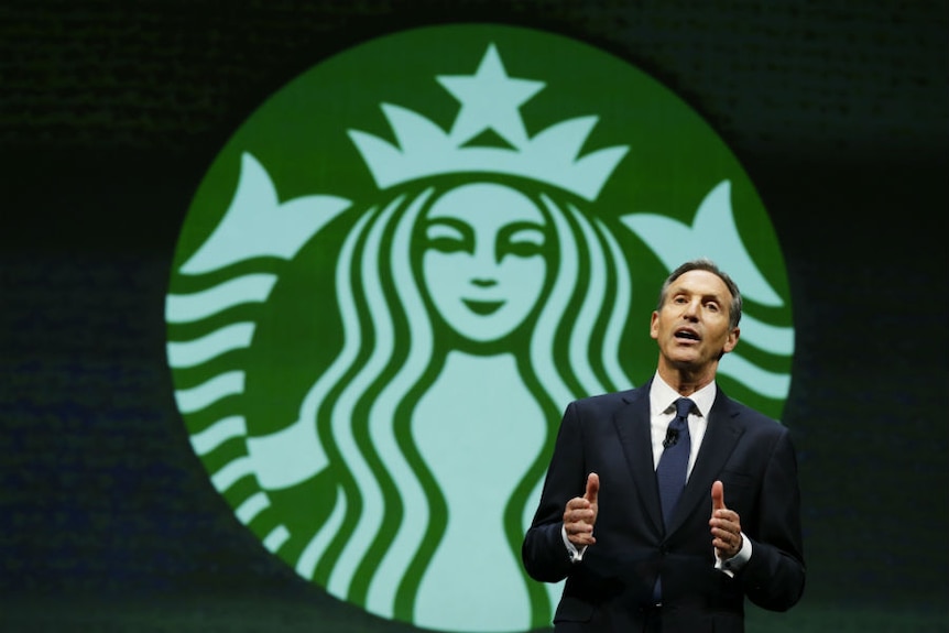 Howard Schultz speaks on stage