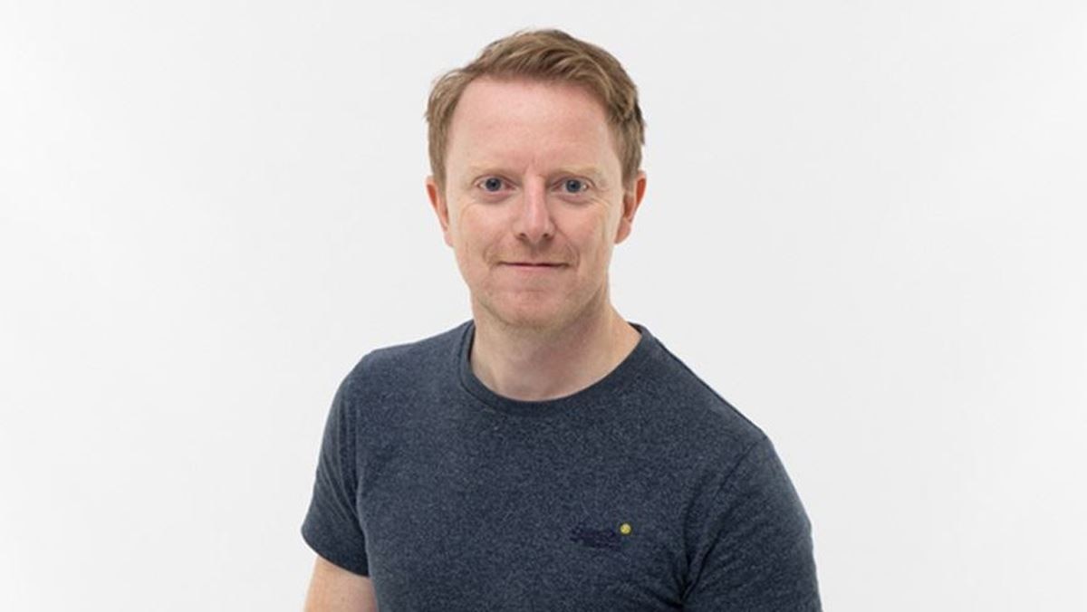 A professional headshot of Mark Serrels against a white background.