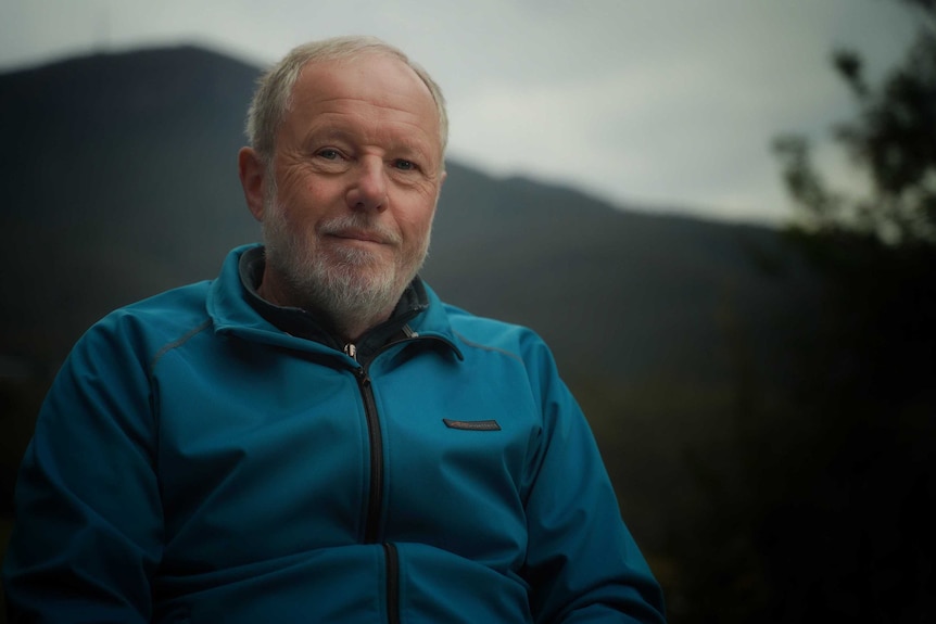 Nicholas Sawyer in front of mountain.