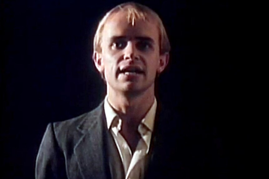 Greg Ham in the Who Can It Be Now video.
