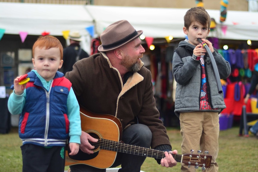 A father and his two sons busk at the Portarlington Celtic Festival.