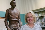 Harrow Discovery Centre manager Josie Sangster in front of a statue of Johnny Mullagh.