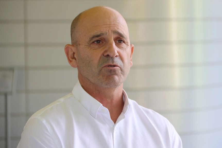 A head and shoulders shot of WAIS chief executive Steven Lawrence speaking during a media conference wearing a white shirt.