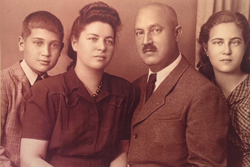 An old photo of two parents and their son and daughter.