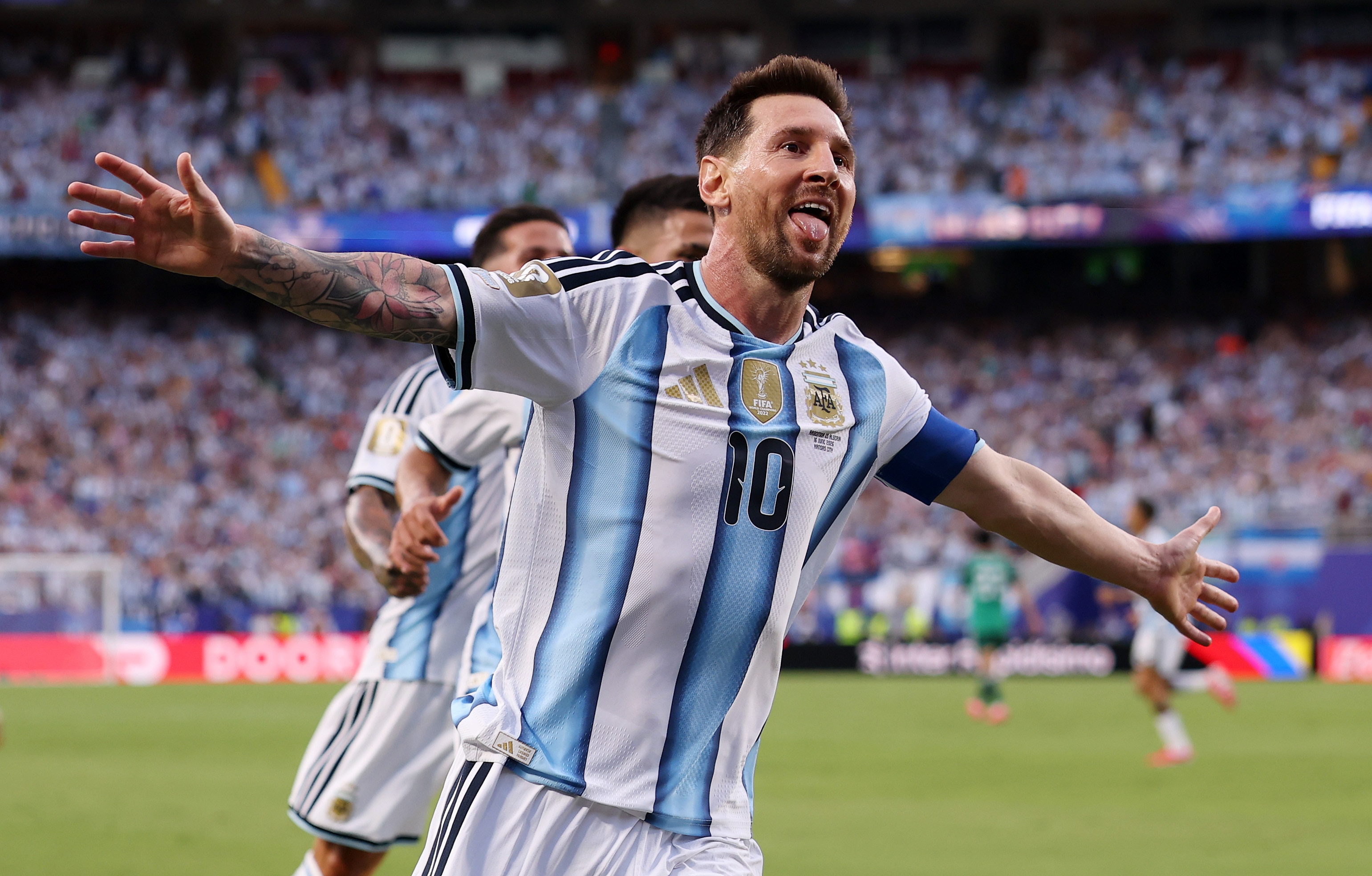 Lionel Messi holds his hands out wide