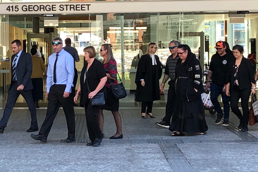 A group of people outside the Supreme Court in Brisbane