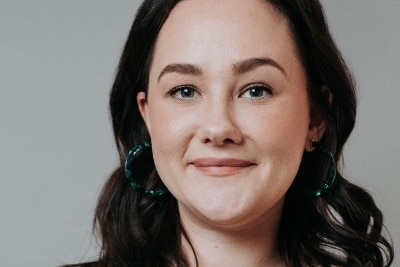 A headshot of a woman with brown hair. 