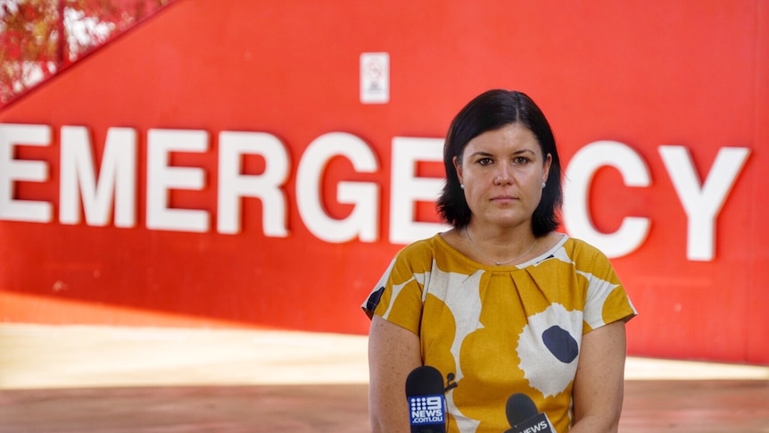 Health Minister Natasha Fyles has a serious expression as she stands outside the ER at RDH.