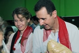 Bashar al-Assad and his wife pack aid boxes
