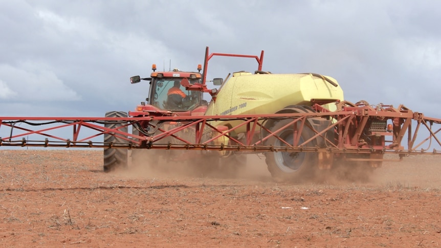 A boom spray in a Mallee paddock prior to sowing
