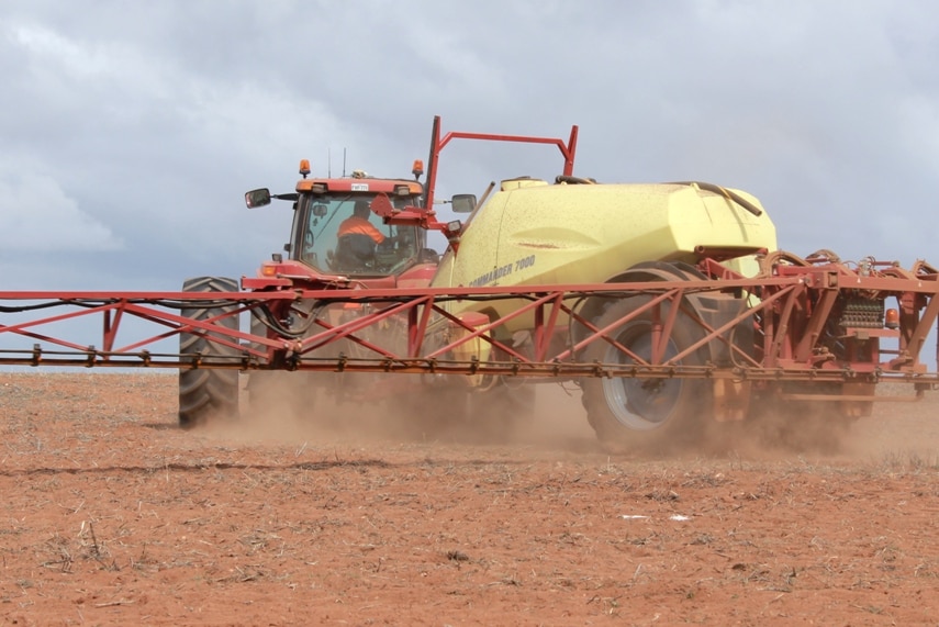 A boom spray in a Mallee paddock prior to sowing