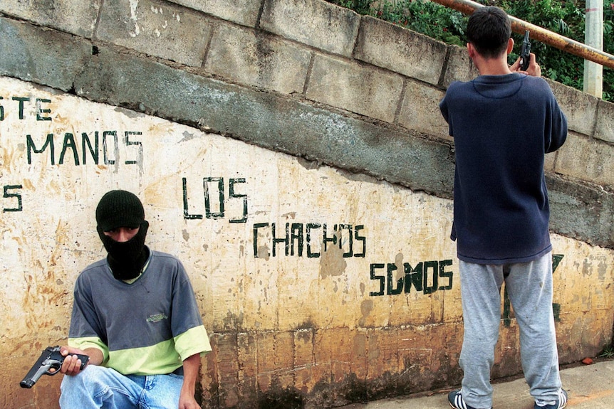 Colombian gunmen posing in north-eastern city of Medellin