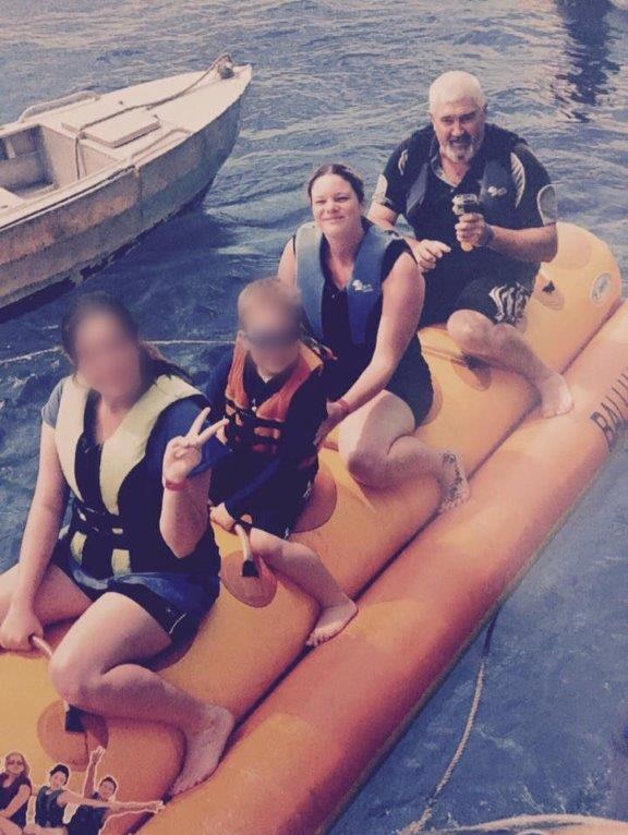 Four people on an inflatable raft