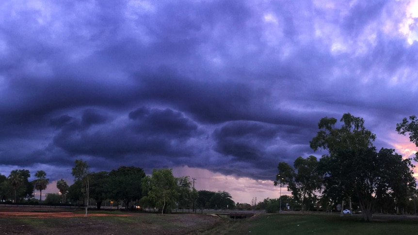 a large storm passing over a park.