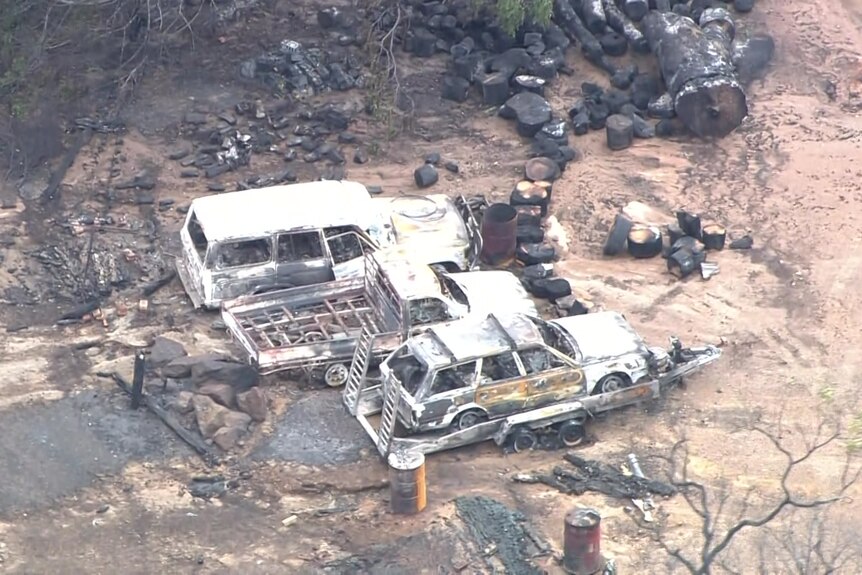 The burnt out remains of three vehicles