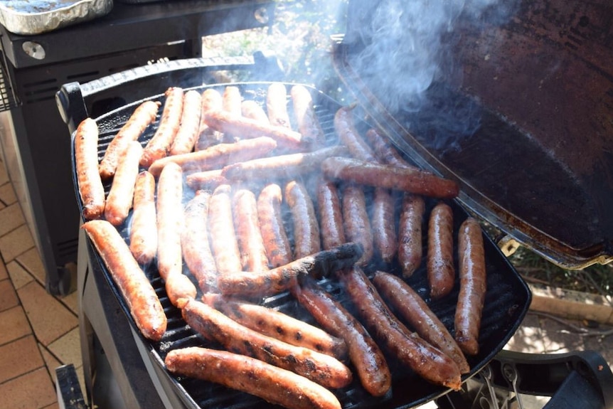 Sausages sizzling on a barbeque