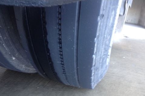 A close up of a worn tyre on a Tip Top truck