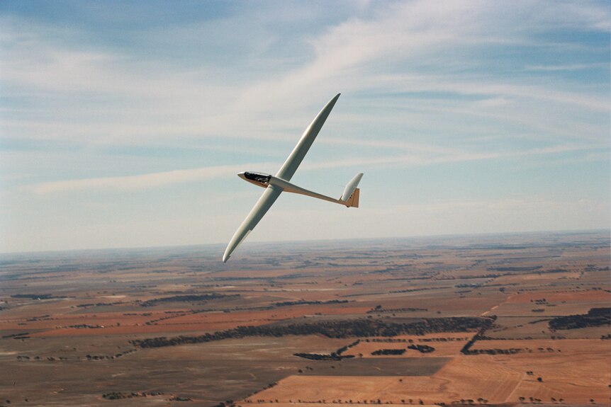 A glider aircraft over outback Australia.