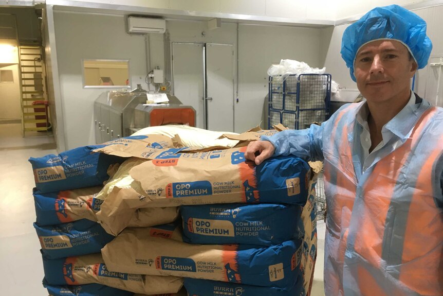 ViPlus Dairy sales and marketing manager Chris McKiernan with bags of powdered milk.