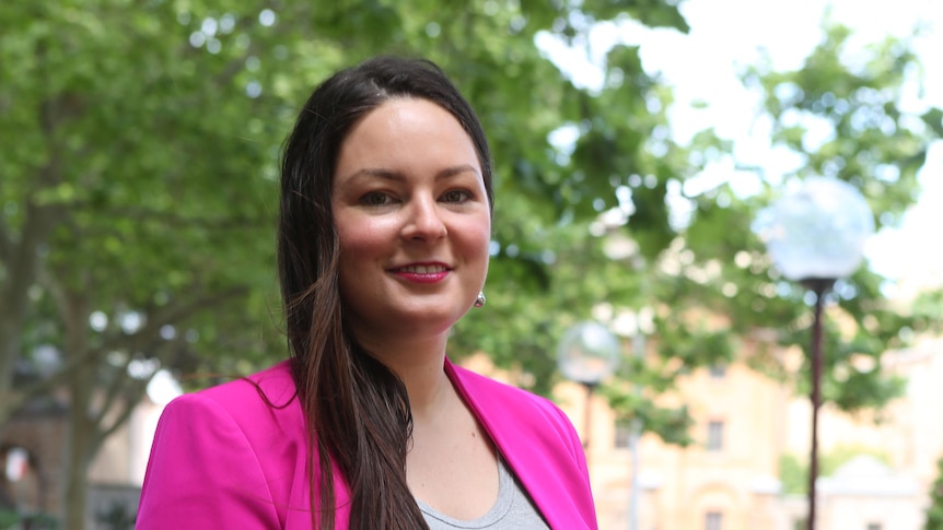 woman in pink suit and pink lipstick 