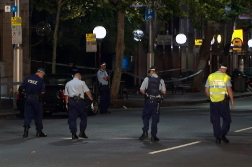 Police search for evidence along Sydney's Macquarie Street.