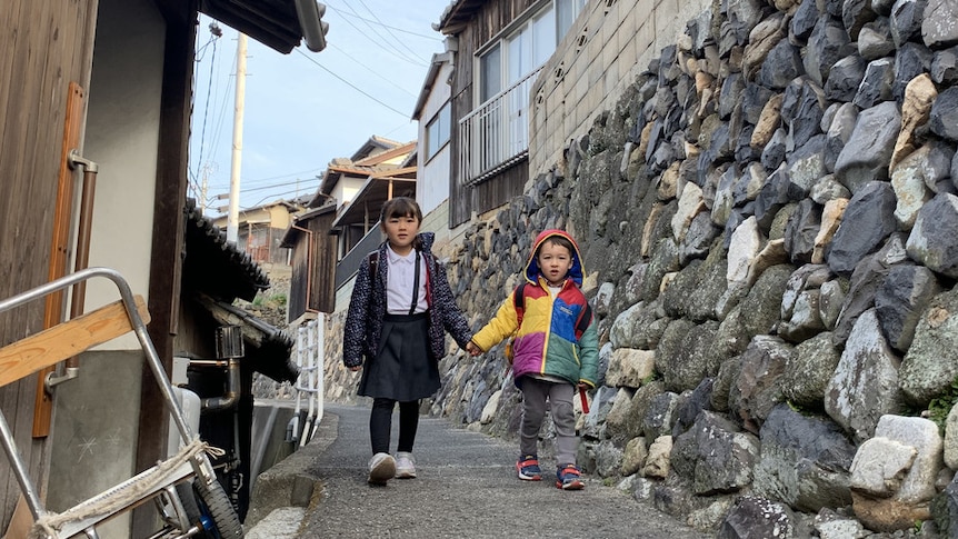 Juna and Remy walking to school in Japan