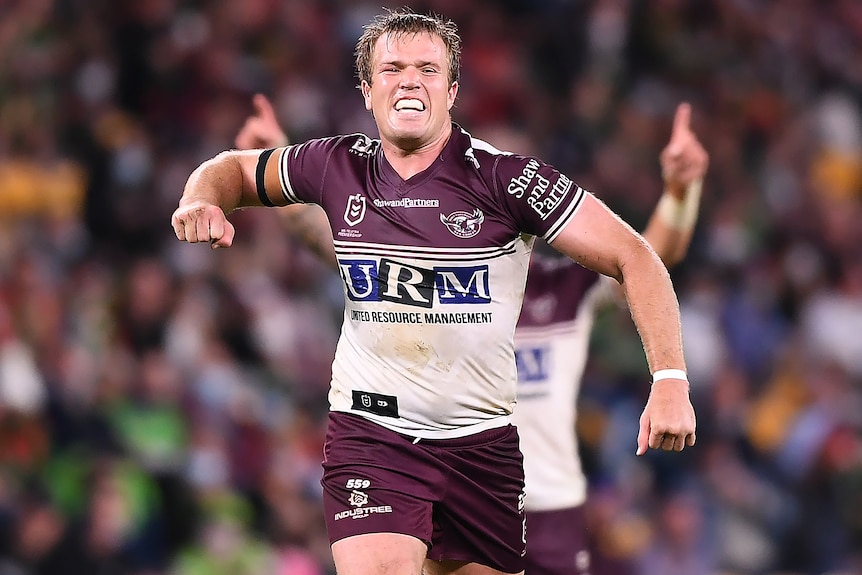 A Manly Sea Eagles NRL player pumps his right fist after his side defeats Canberra.