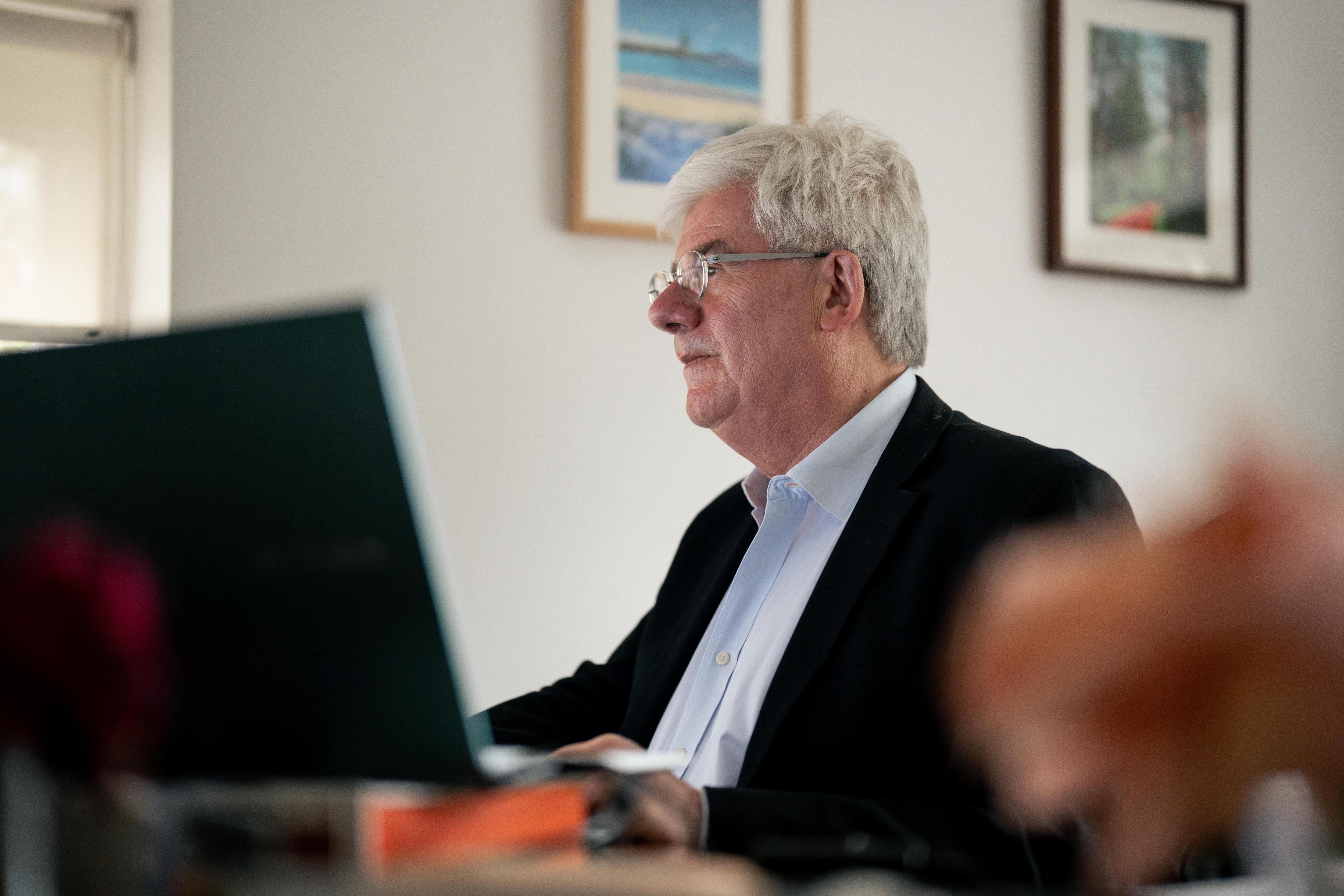 Saul Eslake working at his computer.